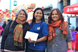 Michelle Wong posing with two festival-goers at the Nite 'n Day Chinatown Firecracker festival