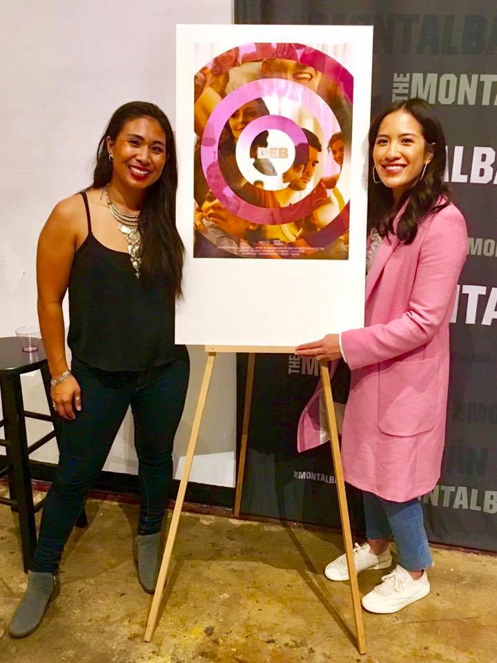 Michelle Wong and a castmate posing with the Deb movie poster on an easel