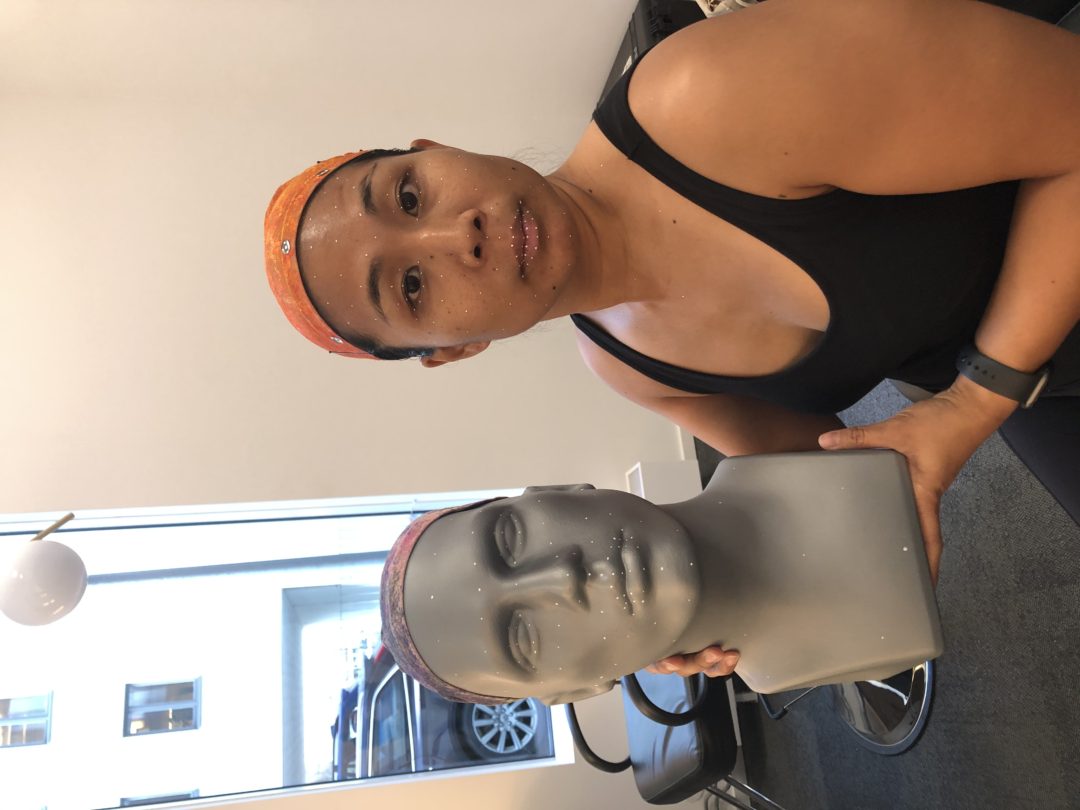 Michelle Wong holding a facial-scan reference head during a motion capture session for an unannounced project