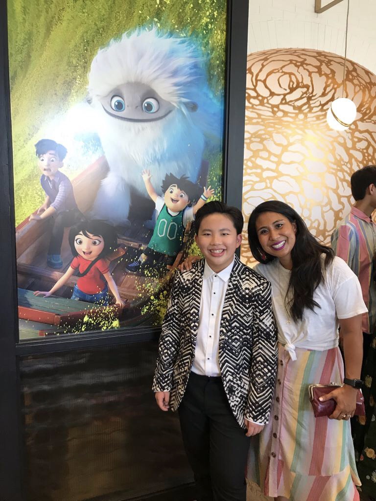 Michelle Wong with young co-star Albert Tsai in front of the Abominable poster