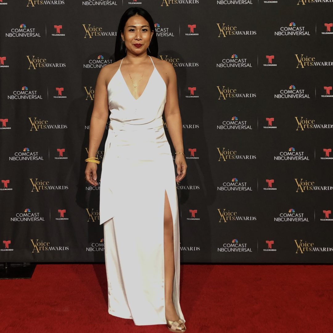 Michelle Wong on the red carpet at the SOVAS Voice Arts Awards, wearing a white gown